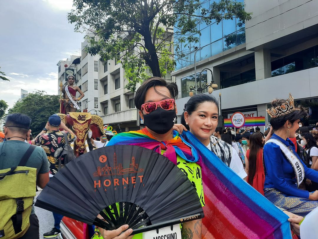 Two people enjoying the Bangkok Pride Parade.