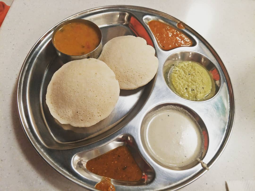 A plate of Southern Indian idli served at Saravana Bhavan.