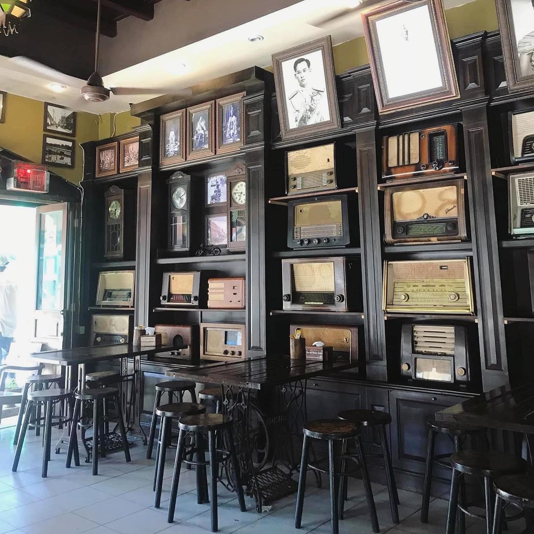 Shelves filled with antique radios at The Old Phuket Coffee "Coffee Station" in Phuket Old Town.