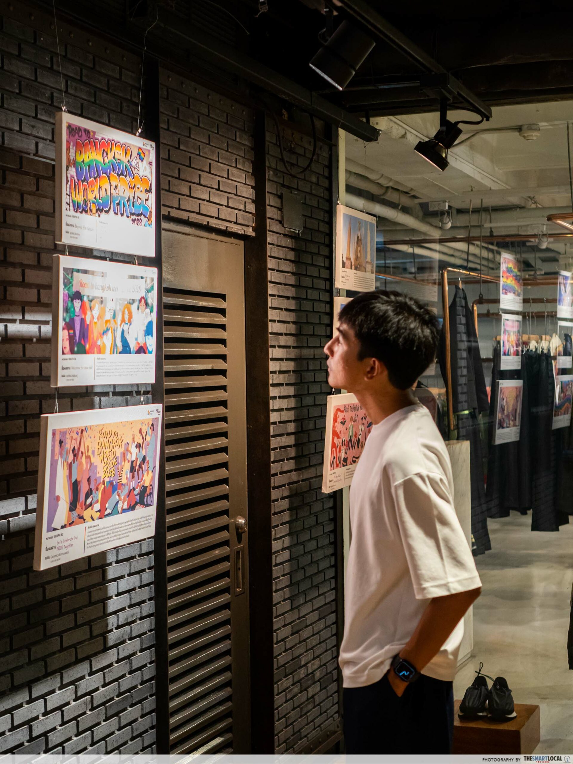 A man checking out the Pride-themed art exhibits at Siam Center during Pride Month 2023. 