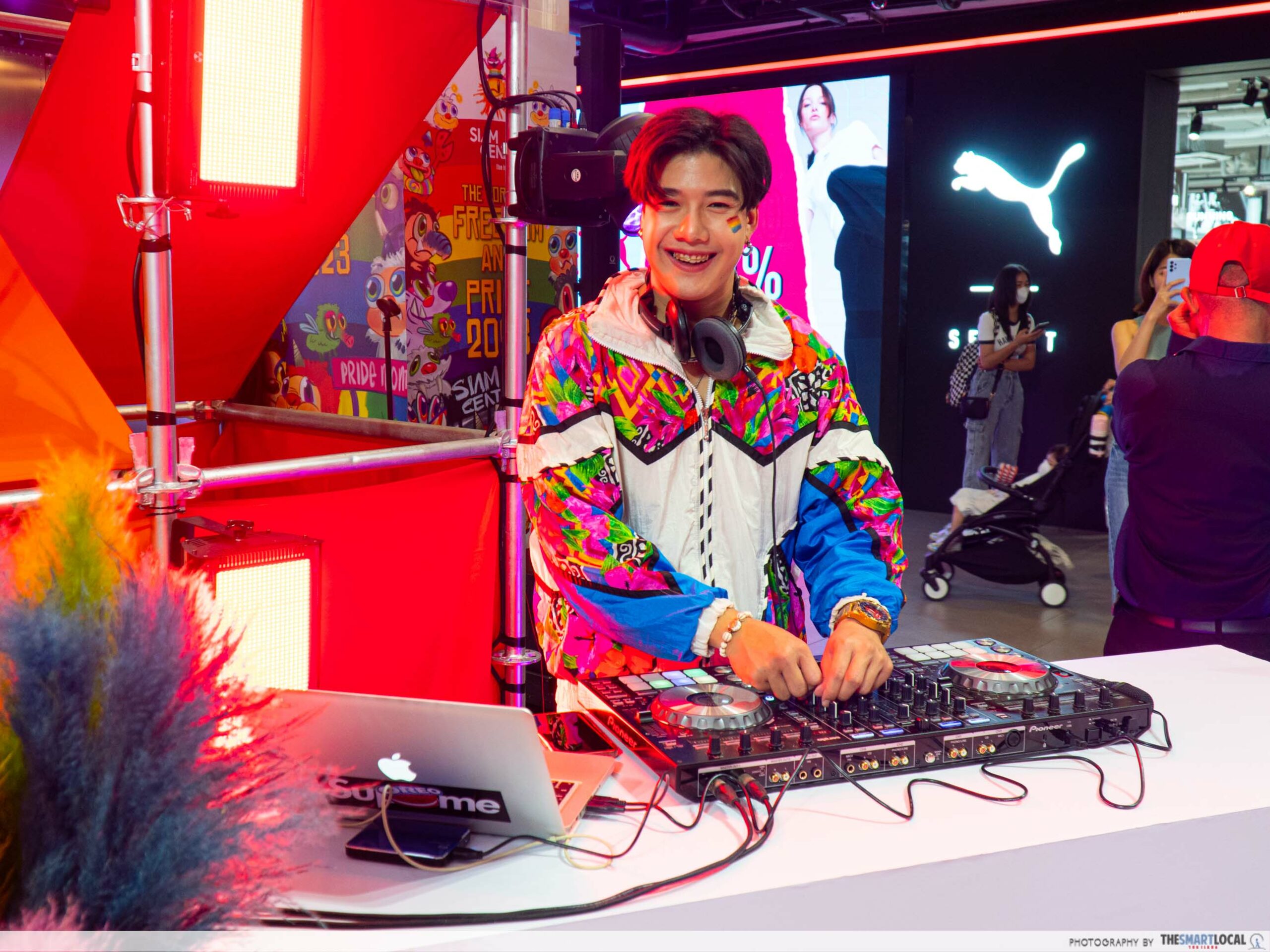 A DJ playing music at Siam Center during the Pride Parade