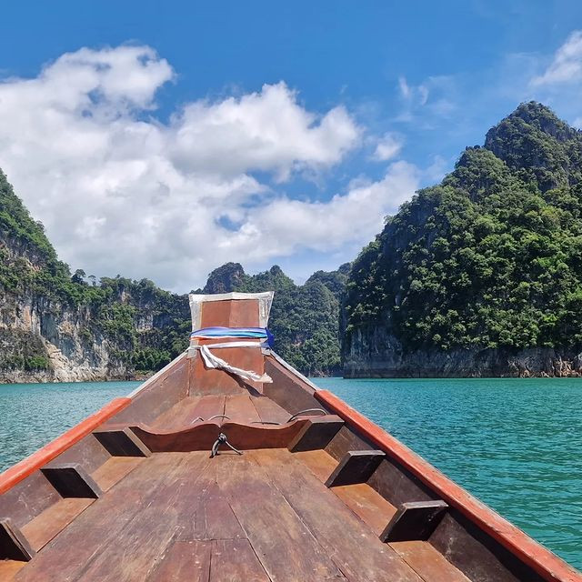 An image taken from a boat in the middle of a lake in Khao Sok National Park in Southern Thailand. 