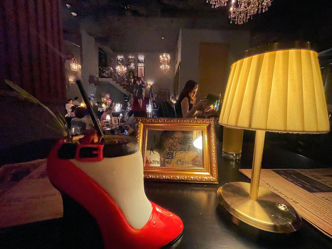 A drink served in a glass shaped like heels. 