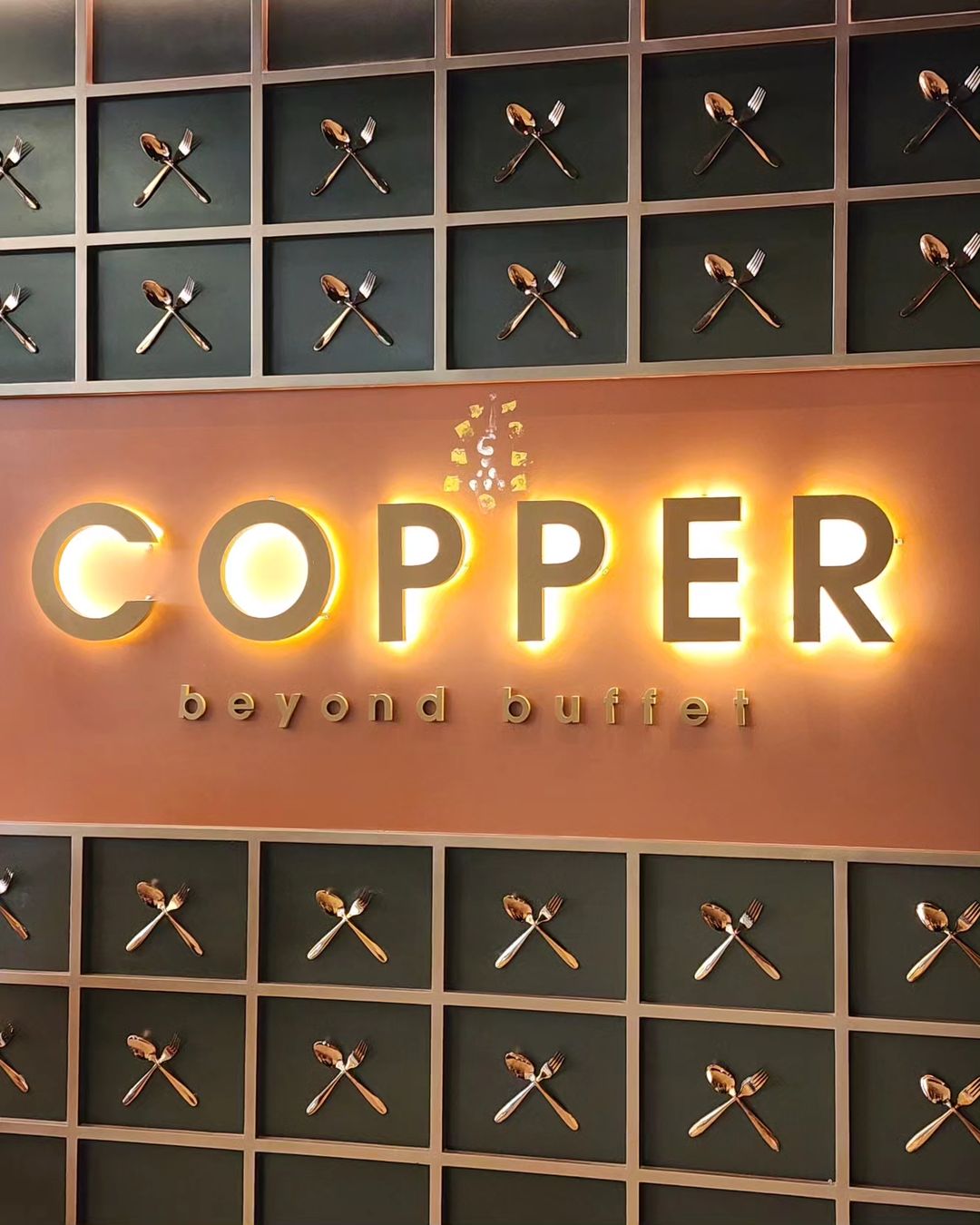 A sign denoting the entrance to Copper Beyond Buffet.