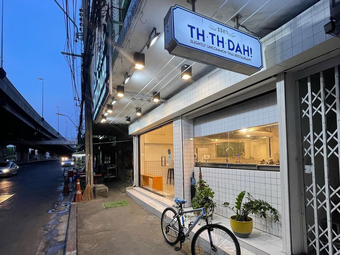 TH TH DAH's shopfront which features a minimal and clean look in contrast to the busy urban shophouses of Bangkok