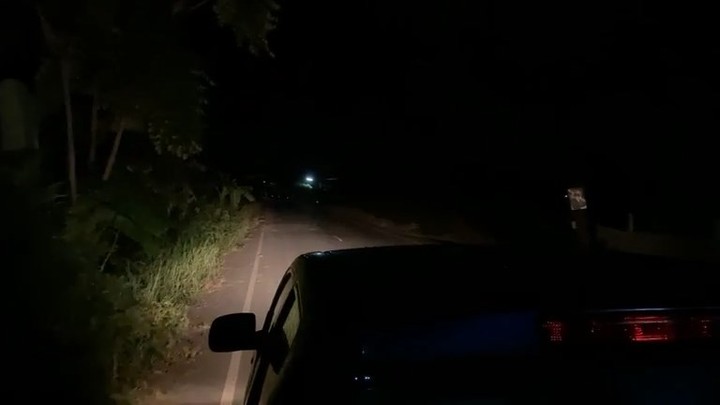 A car driving at night in Lopburi looking for the Thai ghost.