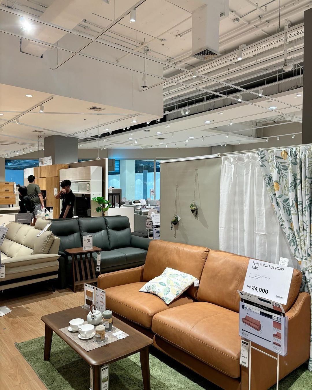 Earth-toned comfy and compact sofas on display at Nitori Thailand
